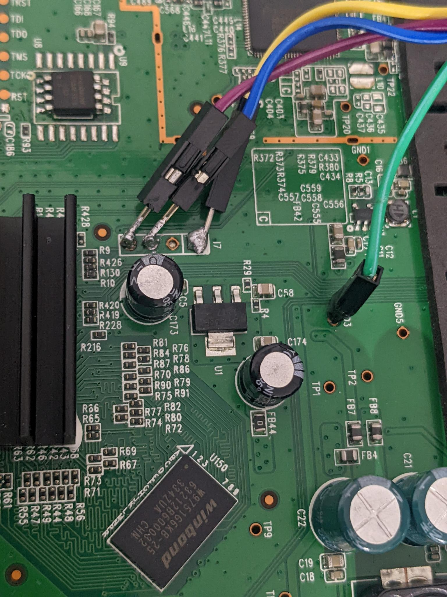 serial wires soldered onto router (close up)